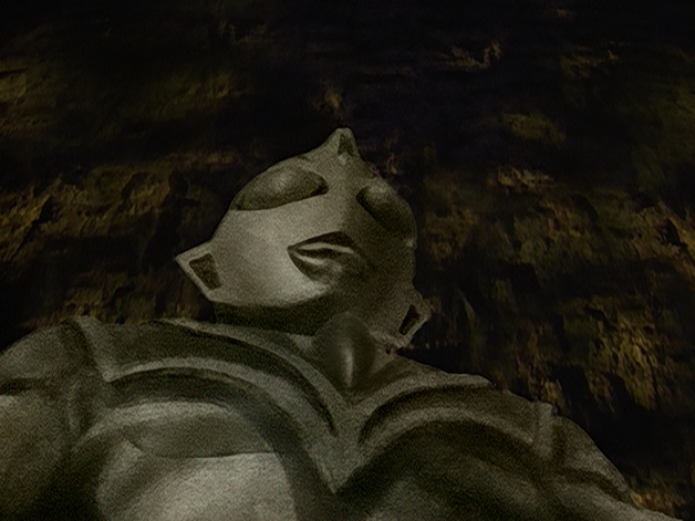 File:Evil Tiga's first apperance as statue.png