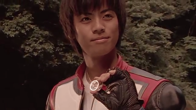 File:Tsubasa with his photograph.png