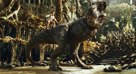 Land-of-the-lost-2009-rick-and-grumpy-tyrannosaurus-rex-fred-flintstone-tail-slide-will-ferrell