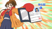 Taneshima showing her ID