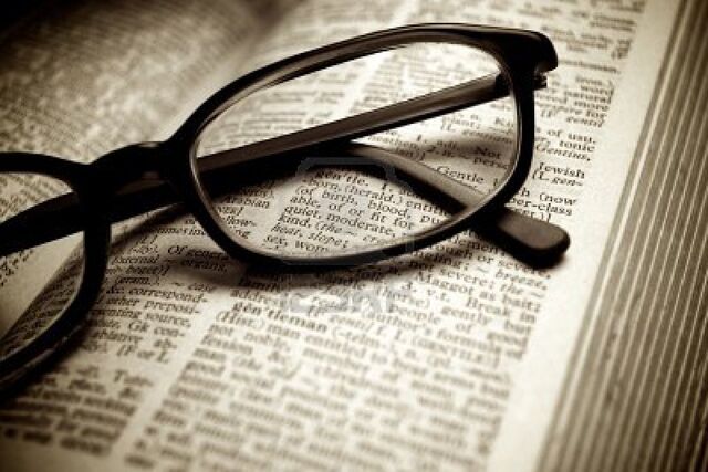 File:10298353-close-up-of-old-dictionary-and-black-glasses.jpg