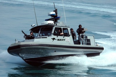 US Navy 050303-N-0000X-002 Sailors assigned to Inshore Boat Unit Two Four (IBU-24) conduct a security patrol in the waters near Kuwait Naval Base