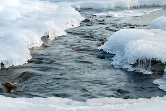 File:2389437-the-winter-river-an-ice-hole-in-the-frozen-river-with-a-rough-stream.jpg