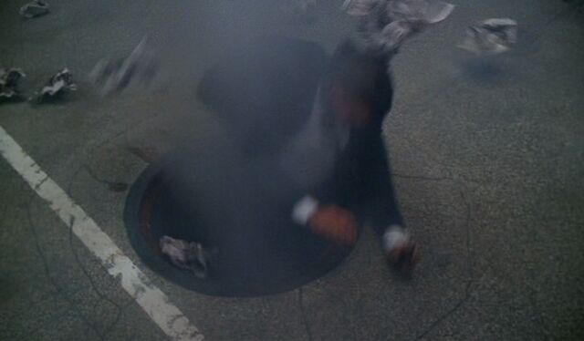 File:MulderSuckedIntoSewer.jpg