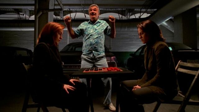 File:Mr. Burt dances as Dana Scully and Monica Reyes play checkers.jpg