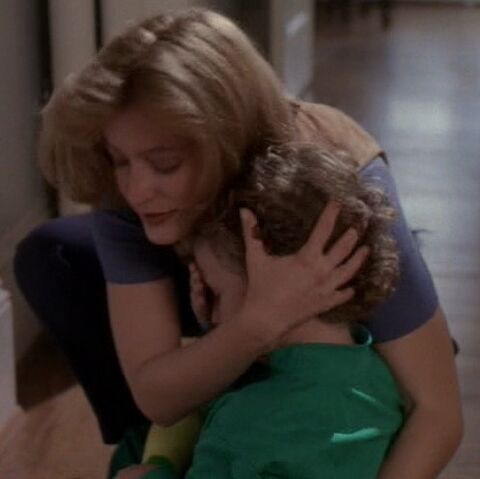 File:Trent held by Scully.jpg