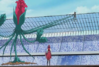 Yusei suspended by Aki's vines