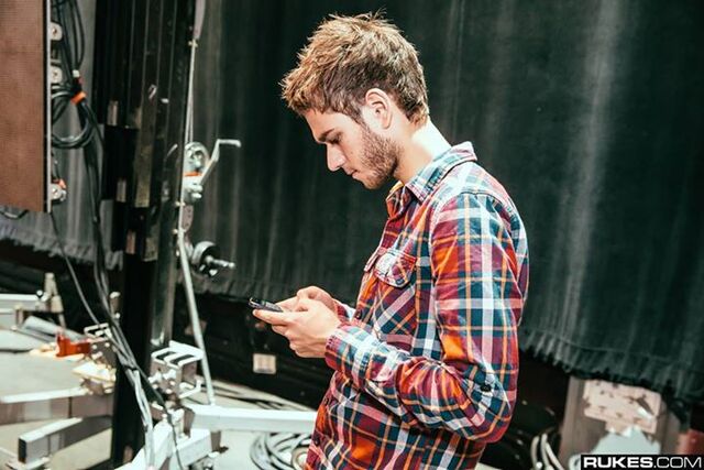 File:Zedd on his phone.jpg